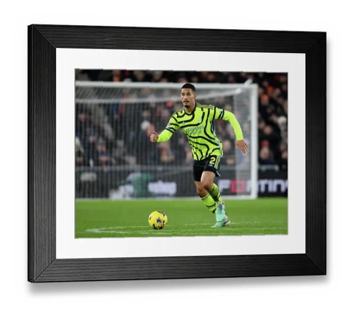 Framed Print : William Saliba's Thunderous Charge: Arsenal's Dominant Performance Against Luton Town, Premier League 2023-24 Framed Print : William Saliba's Thunderous Charge: Arsenal's Dominant Performance Against Luton Town, Premier League 2023-24