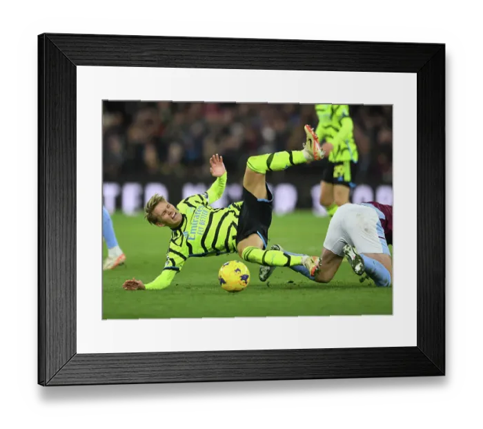 Framed Print : Martin Odegaard in Action: Arsenal's Midfield Maestro Shines Against Aston Villa in the Premier League 2023-24