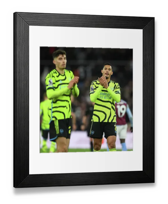Framed Print : Arsenal's William Saliba Celebrates with Fans after Aston Villa Victory (2023-24)