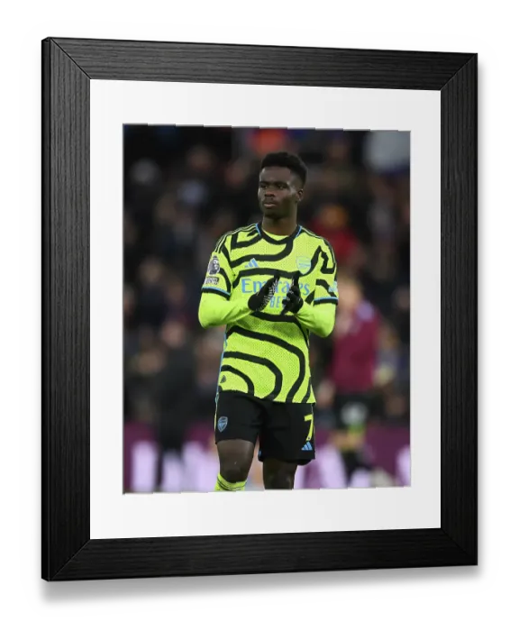 Framed Print : Arsenal's Bukayo Saka Celebrates with Fans after Aston Villa Victory (2023-24) Framed Print : Arsenal's Bukayo Saka Celebrates with Fans after Aston Villa Victory (2023-24)