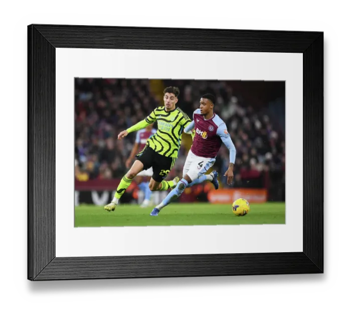 Framed Print : Havertz vs Konsa: Intense Rivalry Unfolds - Aston Villa vs Arsenal FC, Premier League 2023-24