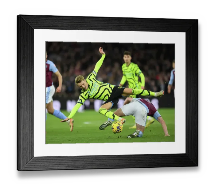 Framed Print : Clash of Midfield Titans: Odegaard vs McGinn in Aston Villa vs Arsenal FC (2023-24)