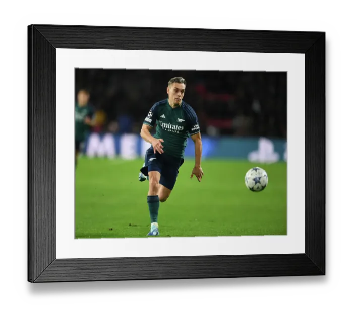 Framed Print : Arsenal's Trossard Stars in Champions League Showdown against PSV Eindhoven (2023-24)