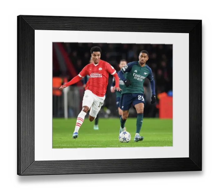 Framed Print : Champions League Showdown: PSV Eindhoven vs. Arsenal FC - Reiss Nelson Faces Off Against Malik Tillman Framed Print : Champions League Showdown: PSV Eindhoven vs. Arsenal FC - Reiss Nelson Faces Off Against Malik Tillman