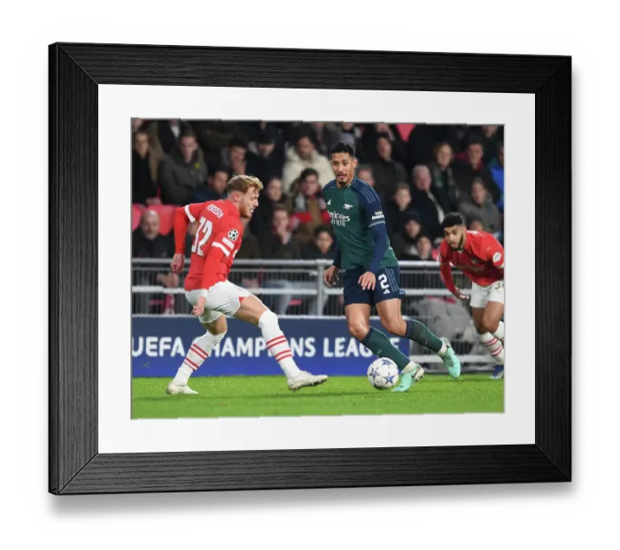 Framed Print : Champions League Group B: PSV Eindhoven vs. Arsenal - Tense Battle between Saliba and Vertessen Framed Print : Champions League Group B: PSV Eindhoven vs. Arsenal - Tense Battle between Saliba and Vertessen