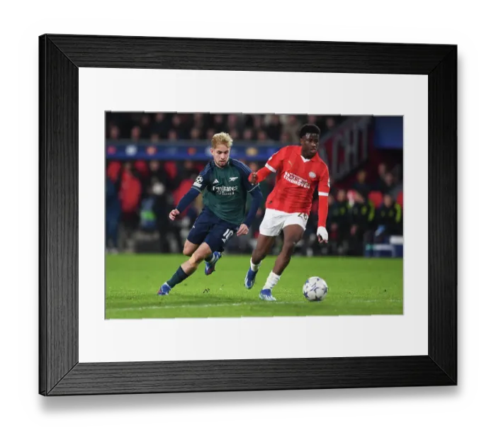 Framed Print : Arsenal's Emile Smith Rowe Closes In on PSV Eindhoven's Isaac Babadi in UEFA Champions League Clash Framed Print : Arsenal's Emile Smith Rowe Closes In on PSV Eindhoven's Isaac Babadi in UEFA Champions League Clash