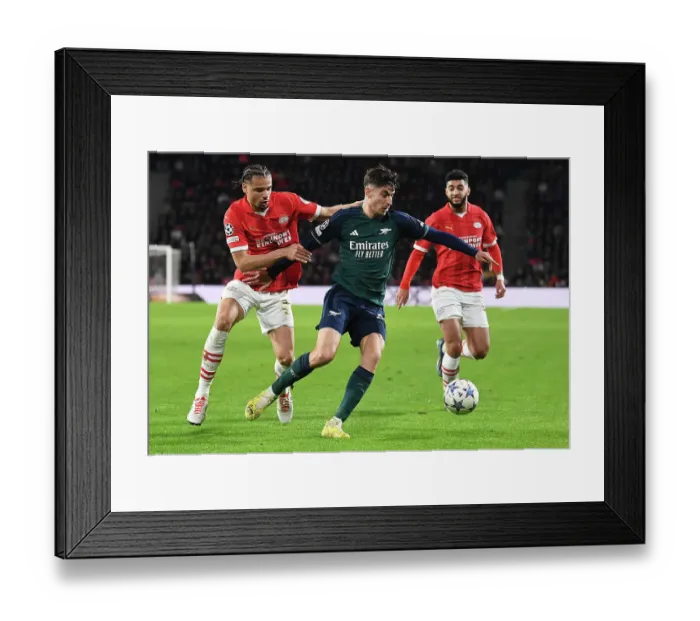 Framed Print : Champions League Showdown: Arsenal vs. PSV Eindhoven - Fight for Group B Supremacy