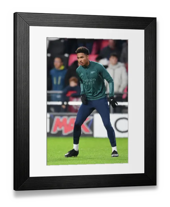 Framed Print : Arsenal's Reuell Walters Warming Up Ahead of PSV Eindhoven Clash in 2023-24 UEFA Champions League