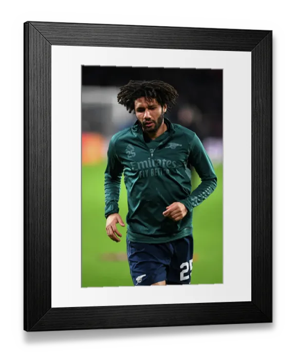 Framed Print : Mohamed Elneny Prepares for Arsenal's Champions League Clash against PSV Eindhoven (2023-24)