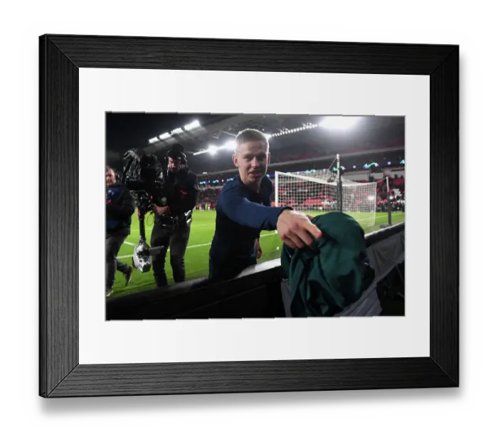 Framed Print : Arsenal's Zinchenko Delights Fan with Shirt Gift After Champions League Victory