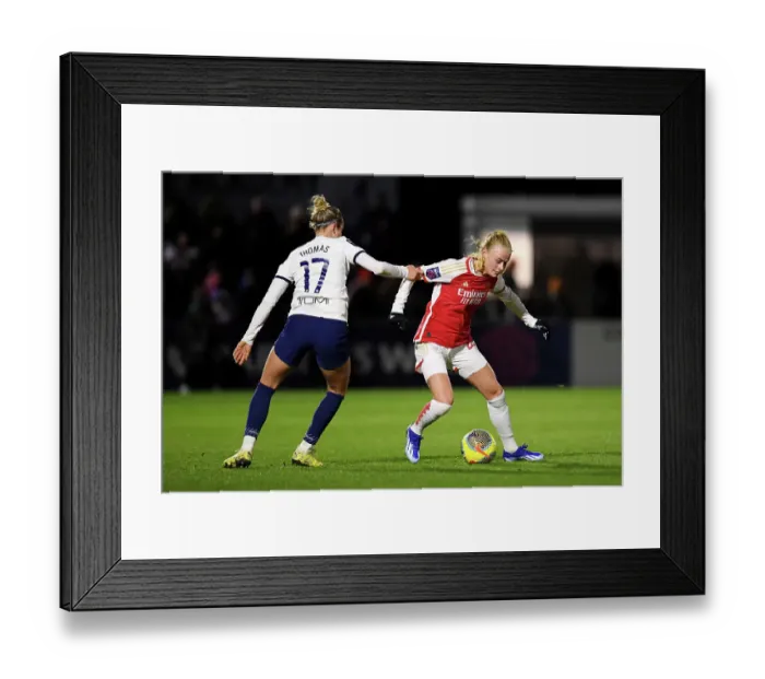 Framed Print : Arsenal vs. Tottenham Women's Clash: A Star-Studded Battle between Kuehl and Thomas in the FA WSL Cup