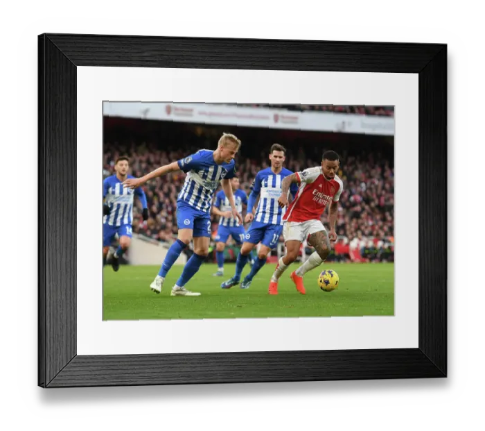 Framed Print : Arsenal's Gabriel Jesus Faces Off Against Brighton's Van Hecke in Premier League Clash (2023-24)
