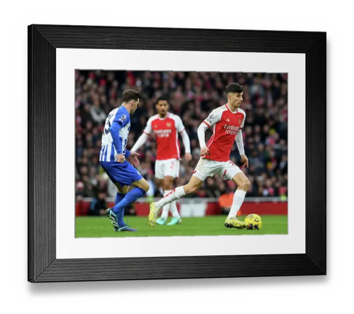 Framed Print : Arsenal's Kai Havertz Outruns Brighton's Pascal Gross in 2023-24 Premier League Clash