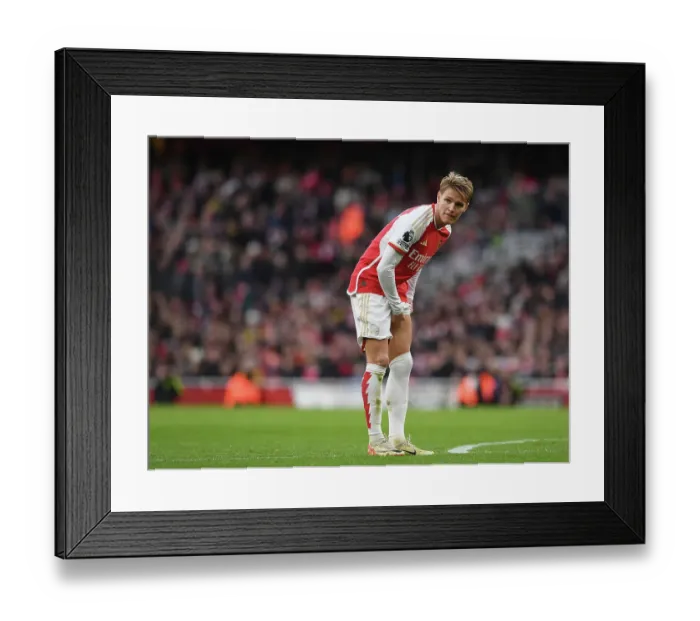 Framed Print : Arsenal's Odegaard: Unwavering Concentration Amidst Premier League Battle (2023-24): Arsenal vs Brighton & Hove Albion Framed Print : Arsenal's Odegaard: Unwavering Concentration Amidst Premier League Battle (2023-24): Arsenal vs Brighton & Hove Albion