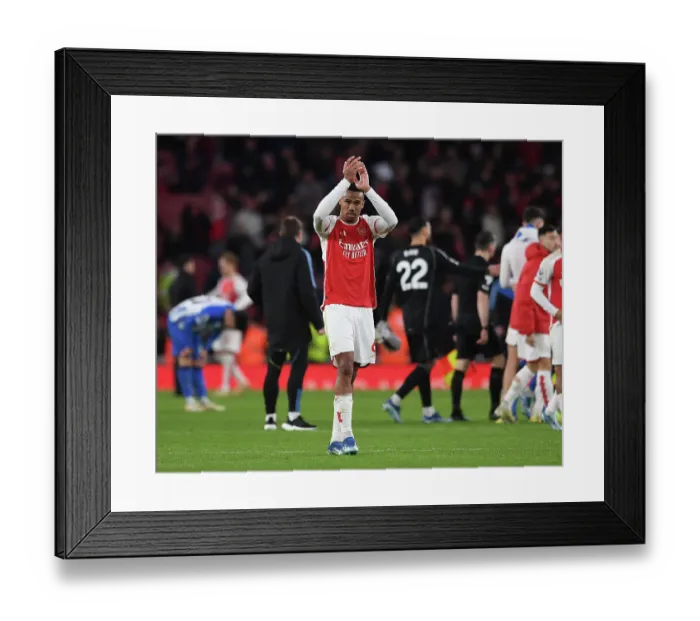 Framed Print : Arsenal's Gabriel Magalhaes Celebrates with Fans After Arsenal v Brighton & Hove Albion Win (2023-24)