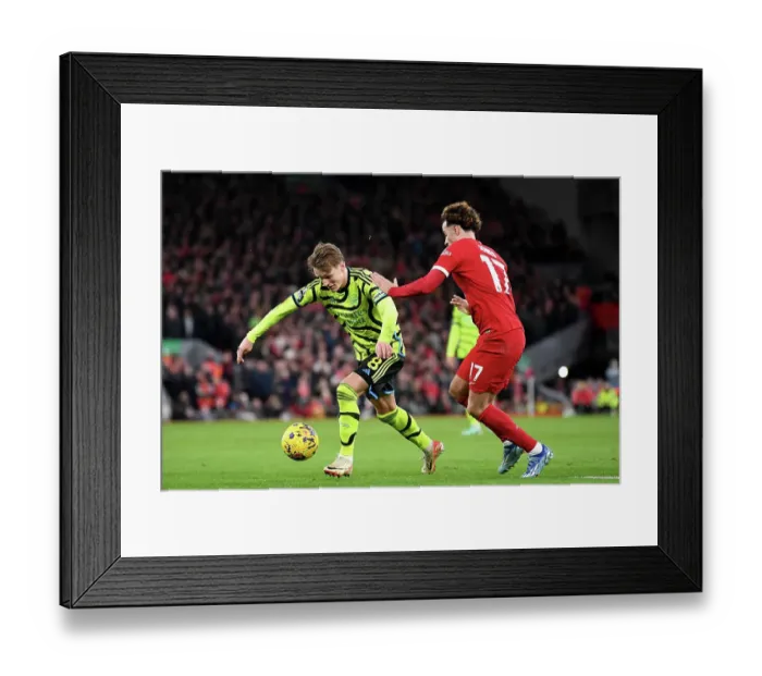 Framed Print : Odegaard vs Jones: Intense Rivalry at Anfield - Liverpool vs Arsenal, Premier League 2023-24