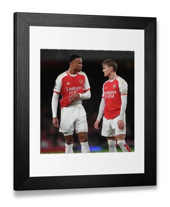 Framed Print : Arsenal's Magalhaes and Odegaard in Action against West Ham United (2023-24) Framed Print : Arsenal's Magalhaes and Odegaard in Action against West Ham United (2023-24)