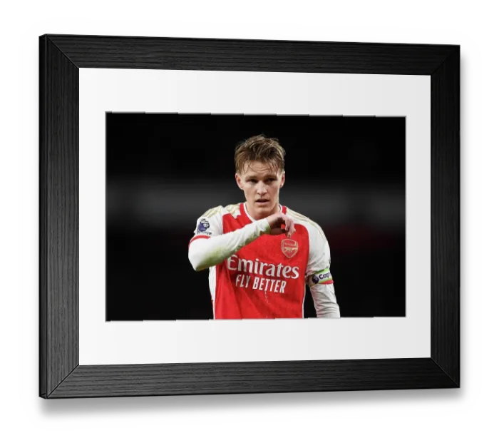 Framed Print : Arsenal vs. West Ham United: Martin Odegaard's Intense Stare at Emirates Stadium (2023-24)