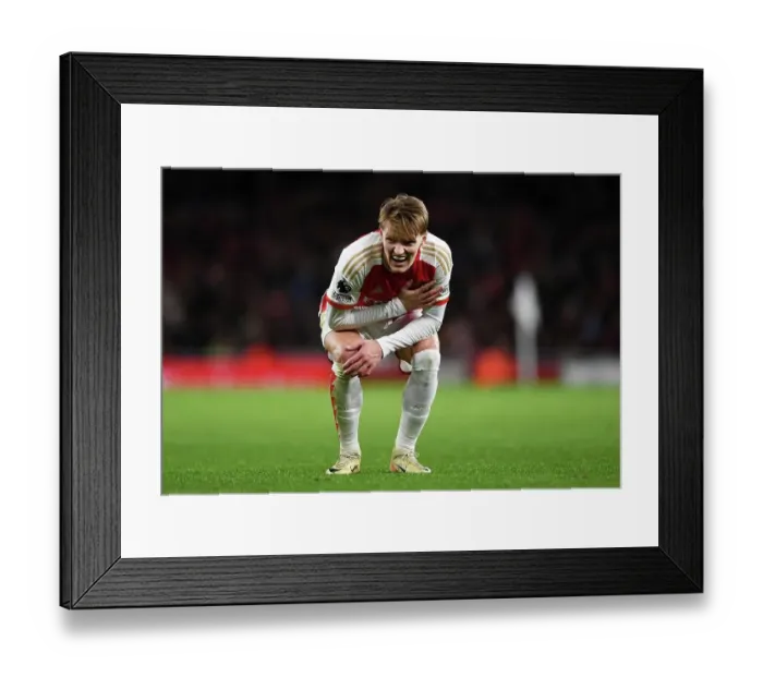 Framed Print : Arsenal's Martin Odegaard Reacts to Injury During Arsenal v West Ham United (2023-24)