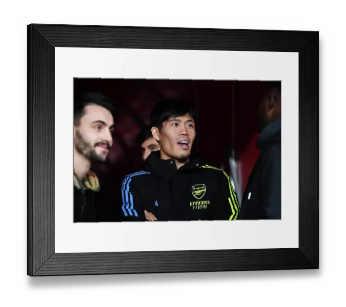 Framed Print : Arsenal's Tomiyasu Watches On: Arsenal FC vs West Ham United, Premier League 2023-24