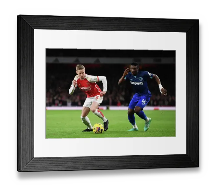Framed Print : Arsenal's Zinchenko Fends Off West Ham's Kudus in Premier League Clash (2023-24)