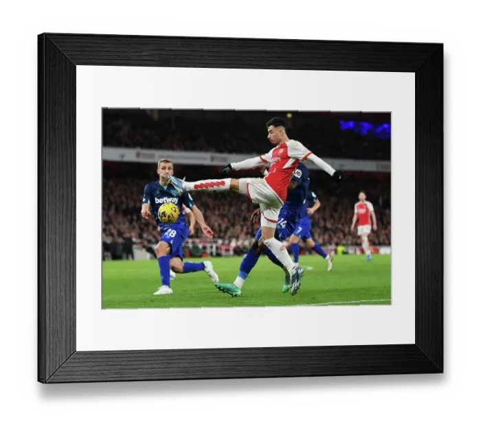 Framed Print : Arsenal's Martinelli Fends Off West Ham Pressure in Premier League Clash (2023-24)