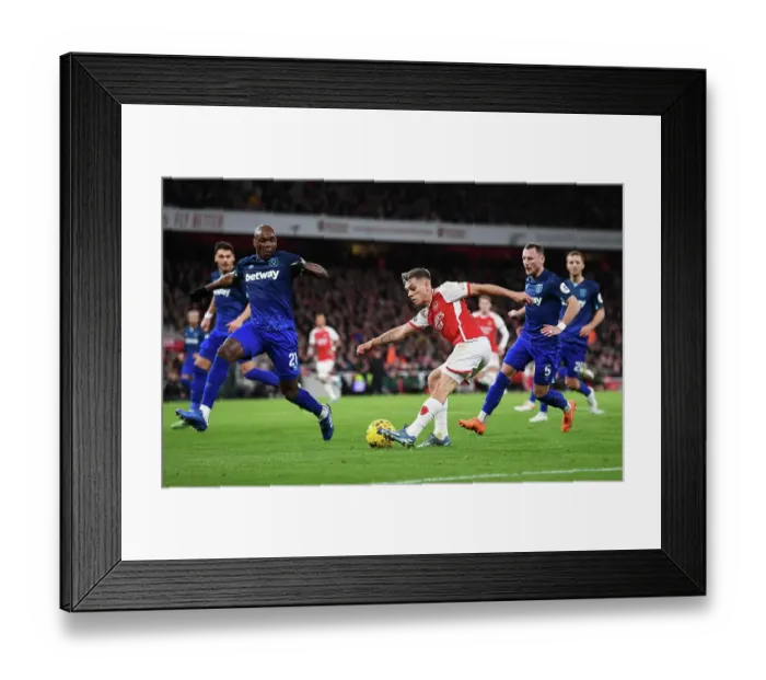 Framed Print : Arsenal's Trossard Faces Off Against Ogbonna in Intense Premier League Clash (2023-24) Framed Print : Arsenal's Trossard Faces Off Against Ogbonna in Intense Premier League Clash (2023-24)