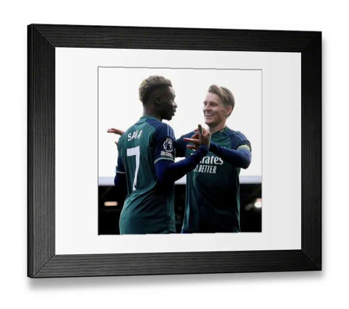 Framed Print : Saka and Odegaard Celebrate Arsenal's First Goal Against Fulham (2023-24) Framed Print : Saka and Odegaard Celebrate Arsenal's First Goal Against Fulham (2023-24)