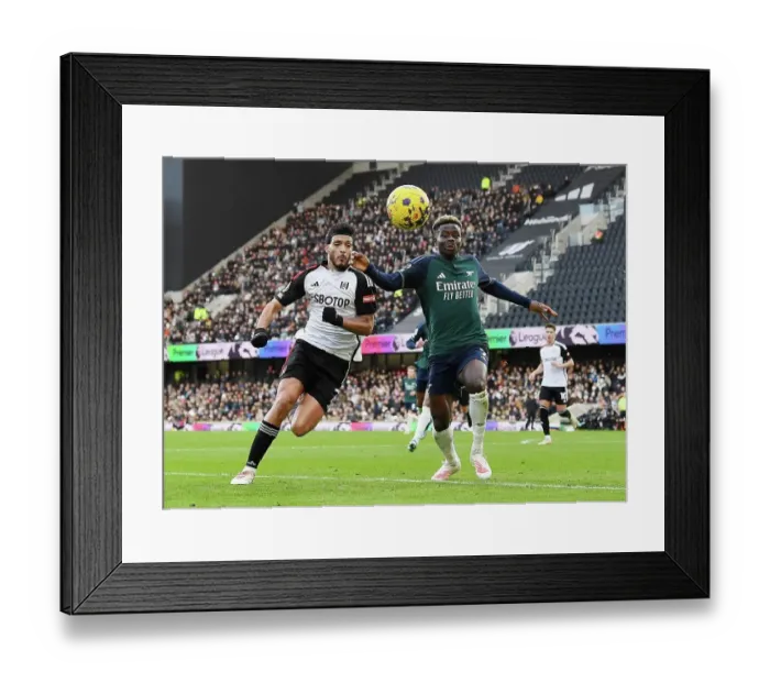 Framed Print : Fulham vs. Arsenal: A Fight for Control in the 2023-24 Premier League - Raul Jimenez vs. Bukayo Saka's Battle for Possession