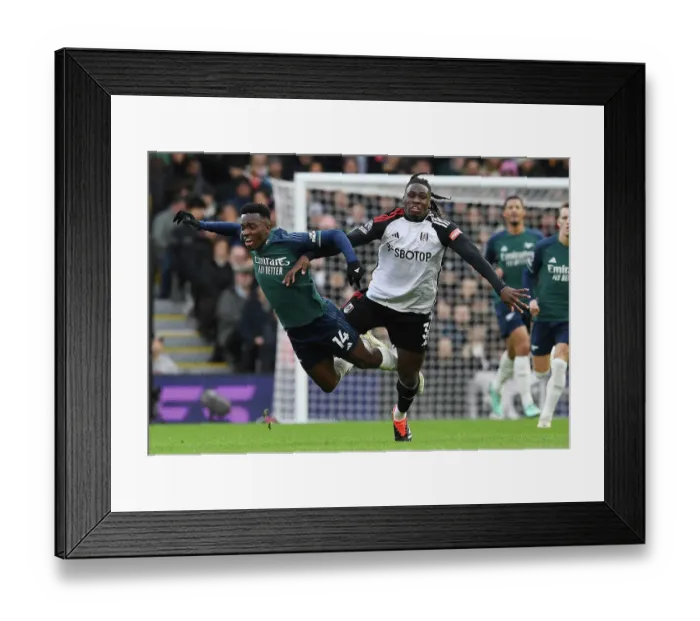 Framed Print : Nketiah vs. Bassey: A Battle at Craven Cottage - Fulham vs. Arsenal in the 2023-24 Premier League Framed Print : Nketiah vs. Bassey: A Battle at Craven Cottage - Fulham vs. Arsenal in the 2023-24 Premier League