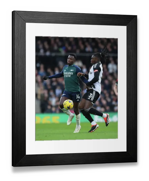 Framed Print : Fulham vs Arsenal: Nketiah vs Bassey Clash in the Premier League, London 2023 Framed Print : Fulham vs Arsenal: Nketiah vs Bassey Clash in the Premier League, London 2023