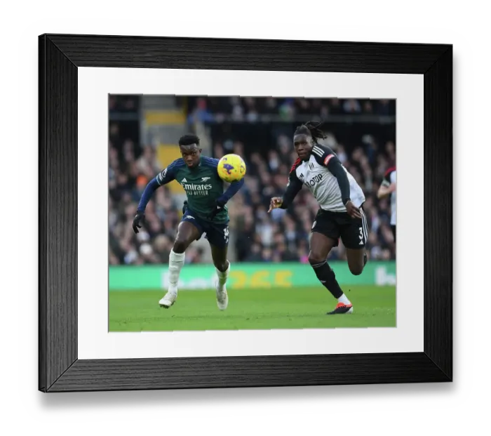Framed Print : Nketiah vs Bassey: A Premier League Rivalry Unfolds - Fulham vs Arsenal (2023-24)