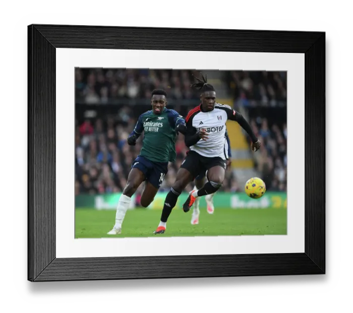 Framed Print : Fulham vs Arsenal: Nketiah Clashes with Bassey in Premier League Showdown (2023-24) Framed Print : Fulham vs Arsenal: Nketiah Clashes with Bassey in Premier League Showdown (2023-24)