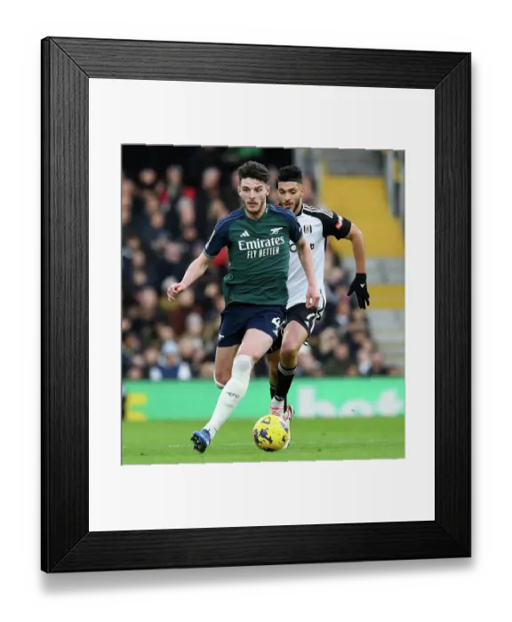 Framed Print : Arsenal's Declan Rice Fights Past Fulham's Raul Jimenez in Premier League Clash (Fulham v Arsenal 2023-24)