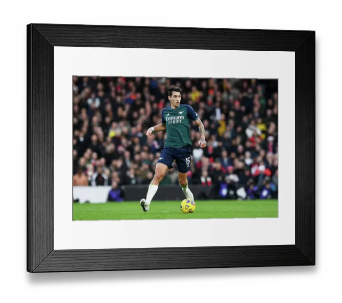 Framed Print : Arsenal's Jakub Kiwior Charges Forward in Premier League Clash Against Fulham (December 2023)