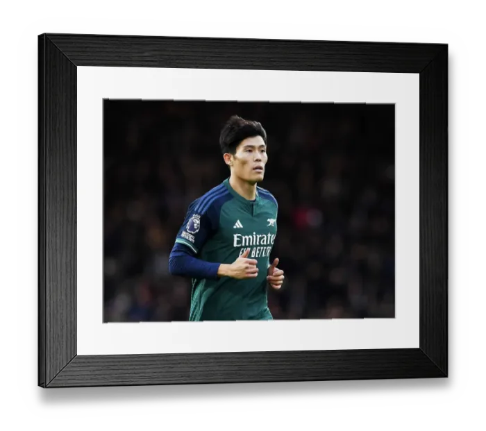 Framed Print : Arsenal's Tomiyasu Watches Fulham Clash in the Premier League (2023-24) Framed Print : Arsenal's Tomiyasu Watches Fulham Clash in the Premier League (2023-24)