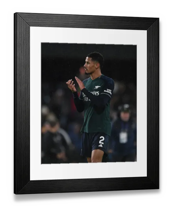 Framed Print : Arsenal's William Saliba Celebrates with Fans after Fulham Victory, 2023-24 Premier League Framed Print : Arsenal's William Saliba Celebrates with Fans after Fulham Victory, 2023-24 Premier League