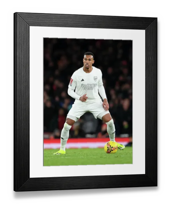Framed Print : Arsenal's Gabriel Charges Forward in White: Emirates FA Cup Battle Against Liverpool