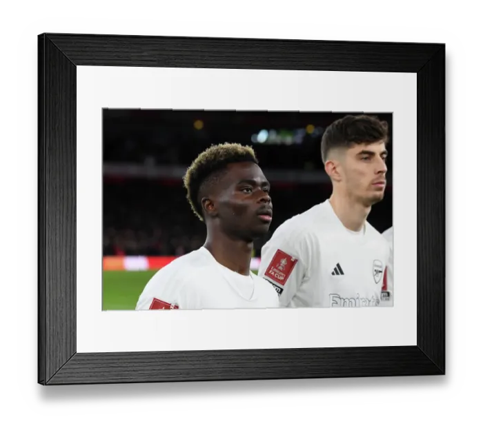 Framed Print : Arsenal's Bukayo Saka: Unwavering Focus Amidst Emirates FA Cup Battle Against Liverpool in Historic No More Red Kit