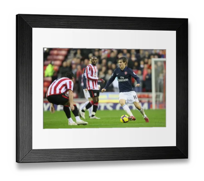Framed Print : Aaron Ramsey (Arsenal) Lorik Cana (Sunderland). Sunderland 1: 0 Arsenal Framed Print : Aaron Ramsey (Arsenal) Lorik Cana (Sunderland). Sunderland 1: 0 Arsenal