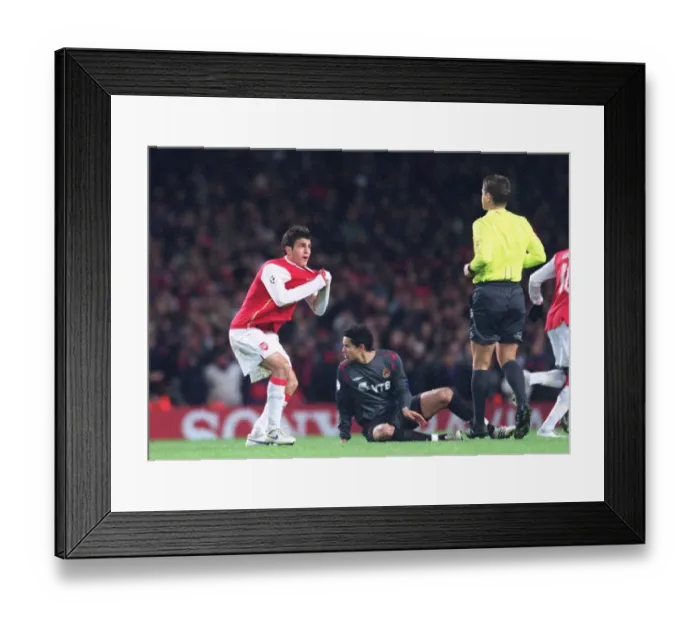 Framed Print : Cesc Fabregas (Arsenal) shows the referee that his shirt was being pulled Framed Print : Cesc Fabregas (Arsenal) shows the referee that his shirt was being pulled