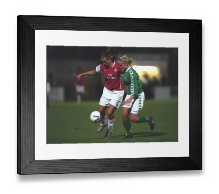 Framed Print : Arsenal's Julie Fleeting Scores against Breidablik's Elin Steinarsdottir in UEFA Cup Quarterfinals (4-1)