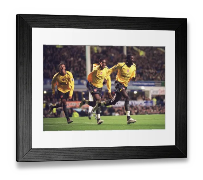 Framed Print : Adebayor's Celebration: Arsenal's Winning Goal vs. Everton (0:1), Carling Cup 4th Round, 2006 - Djourou and Aliadiere Join In