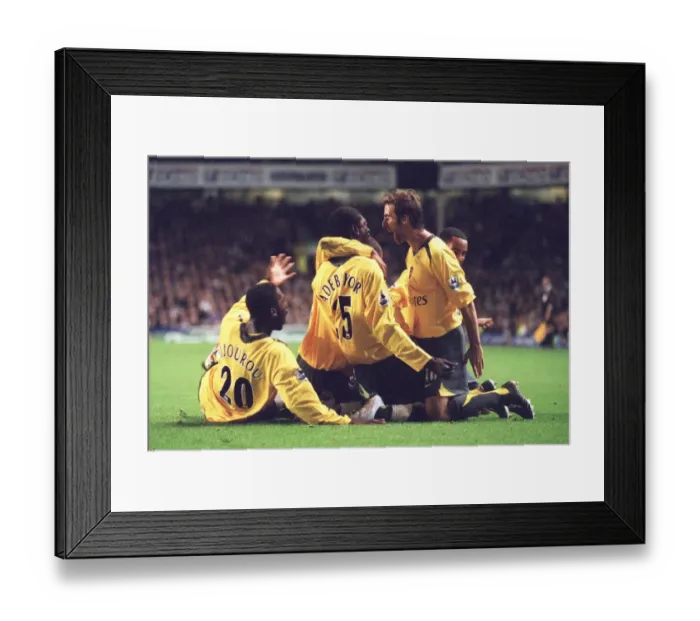 Framed Print : Emmanuel Adebayor celebrates scoring Arsenals goal with Johan Djourou