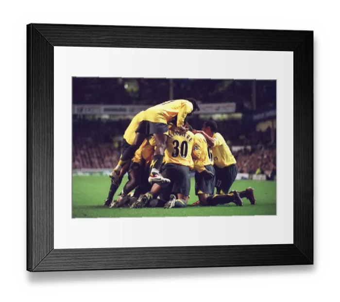Framed Print : Arsenal's Unforgettable Victory: Adebayor's Goal Celebration vs. Everton in the Carling Cup