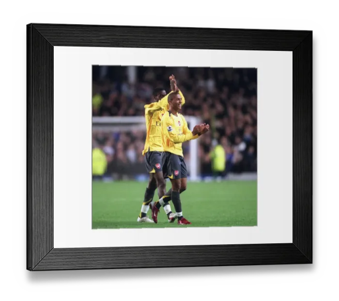 Framed Print : Armand Traore and Johan Djourou (Arsenal) clap the fans after the match