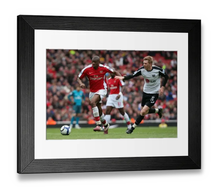 Framed Print : Abou Diaby (Arsenal) David Elm (Fulham). Arsenal 4: 0 Fulham. Barclays Premier League Framed Print : Abou Diaby (Arsenal) David Elm (Fulham). Arsenal 4: 0 Fulham. Barclays Premier League