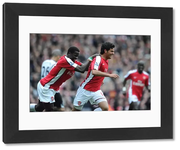 Carlos Vela celebrates scoring the 4th Arsenal goal with Emmanuel Eboue