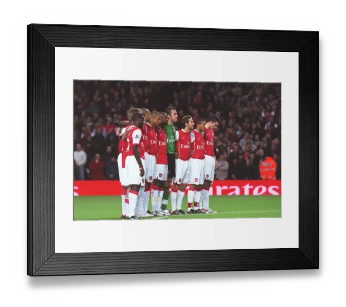 Framed Print : The Arsenal players line up for a minutes silence for Rememberence Day before the match