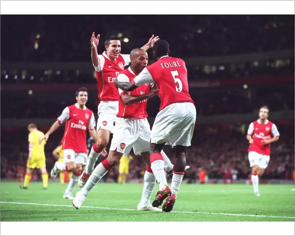 Arsenal's Unforgettable Triumph: Toure, Henry, and van Persie Celebrate a 3:0 Victory Over Liverpool